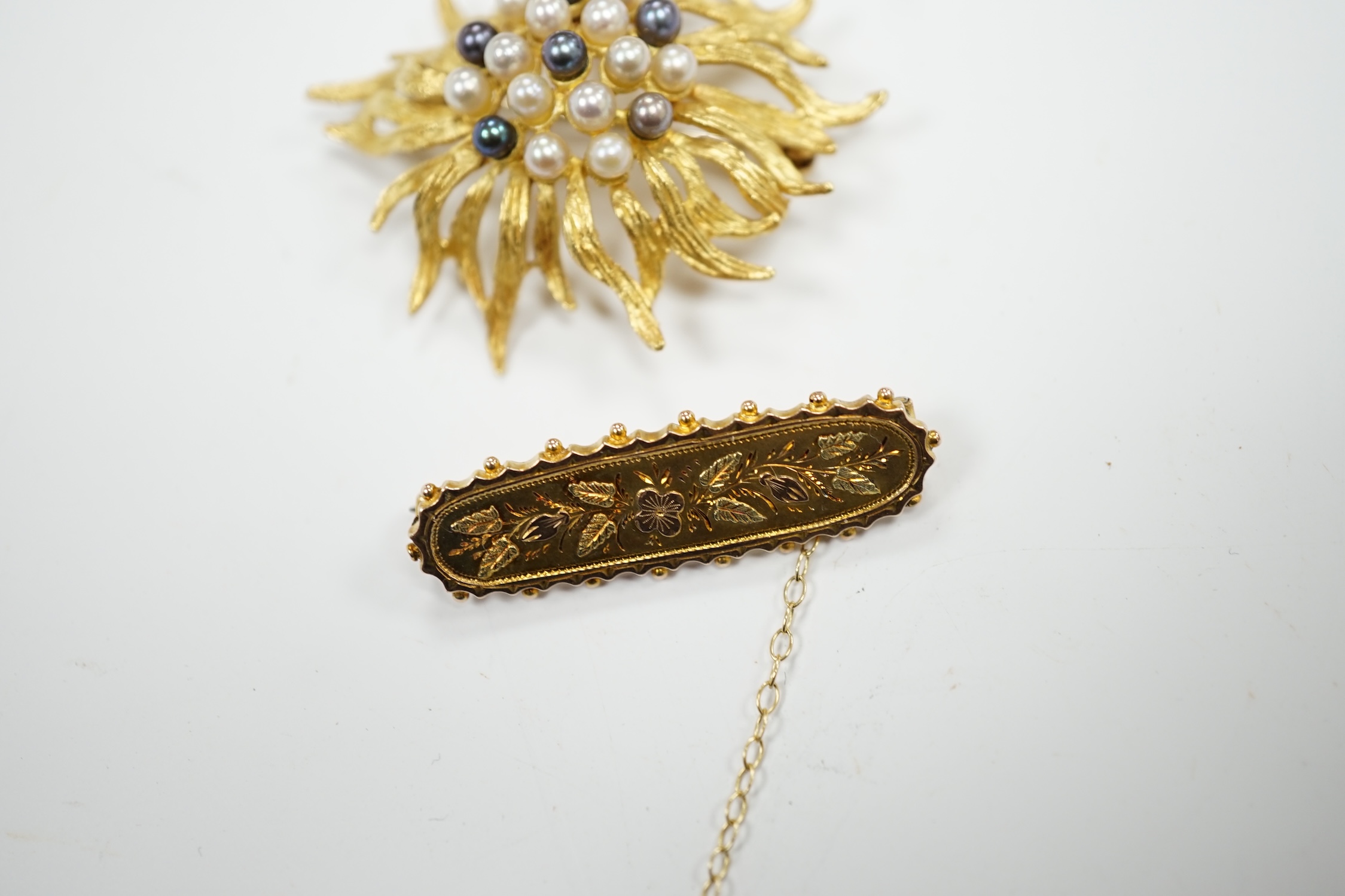 A continental 750 yellow metal and cultured pearl cluster set brooch, 44mm, gross weight 11.5 grams, together with a late Victorian three colour gold bar brooch, gross 2.4 grams.